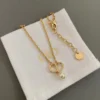 Petit CD Necklace Petit CD Bracelet