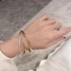Trinity bracelet, small model, half-paved