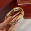 Trinity bracelet, small model, half-paved