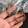 Chanel Metal Lambskin Quilted CC Turnlock Chain Hoop Earrings Gold Black