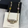 Chanel Necklace – Metal, glass pearls & strass, gold, pearly white & multicolor