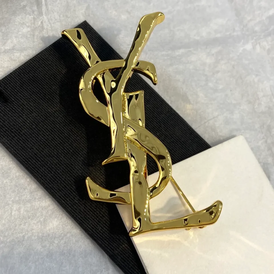 YSL Metal brooch
