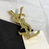 YSL Metal brooch