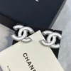 CC Logo Chanel white enamel earrings