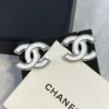 CC Logo Chanel white enamel earrings