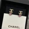 CHANEL earrings with purple stars