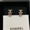 CHANEL earrings with purple stars