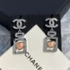 CHANEL perfume bottle earrings with cc logo