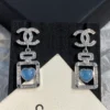 CHANEL perfume bottle earrings with cc logo