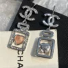 CHANEL perfume bottle earrings with cc logo