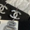 CHANEL perfume bottle earrings with cc logo