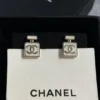 CHANEL white perfume bottle earrings