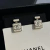 CHANEL white perfume bottle earrings