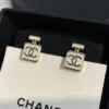 CHANEL white perfume bottle earrings