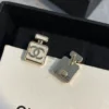 CHANEL white perfume bottle earrings