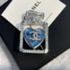 Chanel perfume brooch