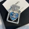 Chanel perfume brooch