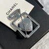 Chanel perfume brooch