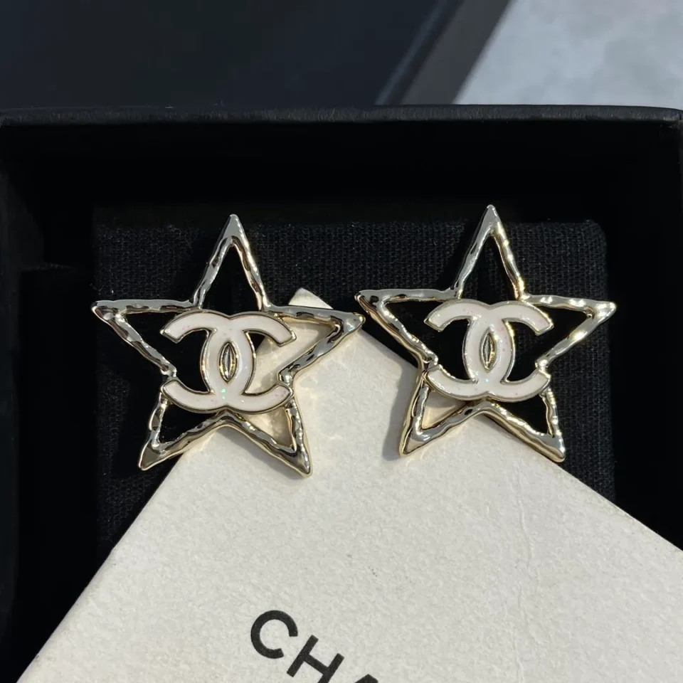 CHANEL star earrings with logo