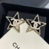 CHANEL star earrings with logo