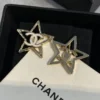CHANEL star earrings with logo