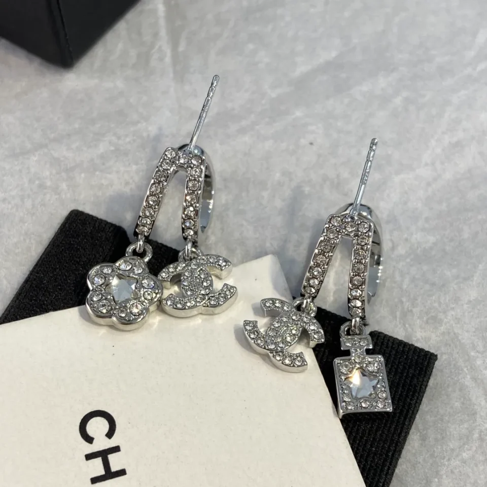 CHANEL silver perfume bottle earrings