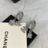CHANEL silver perfume bottle earrings