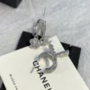 CHANEL silver perfume bottle earrings