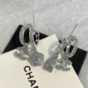 CHANEL silver perfume bottle earrings