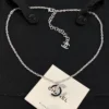 CHANEL black enamel CC-shaped pendant