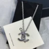 CHANEL black enamel CC-shaped pendant