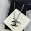 CHANEL black enamel CC-shaped pendant