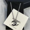CHANEL black enamel CC-shaped pendant