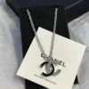 CHANEL black enamel CC-shaped pendant