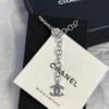CHANEL black enamel CC-shaped pendant