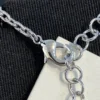 CHANEL black enamel CC-shaped pendant