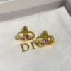 Petit CD Jolie Mini Stud Earrings