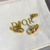 Petit CD Jolie Mini Stud Earrings