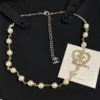 CHANEL hear shape pearl pedant necklace ,golden/silver