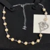 CHANEL hear shape pearl pedant necklace ,golden/silver