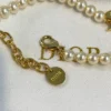 Dio(r)evolution pearl bracelet with logo