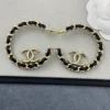CHANEL leather half-circle earrings