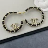 CHANEL leather half-circle earrings