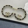 CHANEL leather half-circle earrings