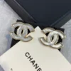 Chanel white iridescent stud earrings