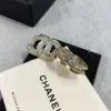 Chanel white iridescent stud earrings