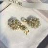 Dior pearl ear studs
