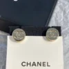 Chanel button ear studs