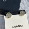 Chanel button ear studs