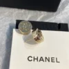Chanel button ear studs